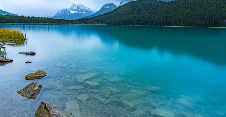 Reflection of the mountains off Waterfowl Lakes in Banff National Park Canada